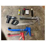 Hand tool assortment to include caulking guns, flatback miter saw, small Black & Decker drill/ driver, working condition unknown, and more. See pictures for details.