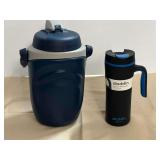 Aladdin travel mug, also includes a Thermos water container, see pictures for details.