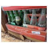 VINTAGE WOODEN COCA-COLA DRINK CRATE AND VARIOUS BRAND SODA BOTTLES IN BOTTOM LEVEL MARKED 1407