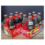 VINTAGE COCA-COLA BOTTLES WITH PAPER CARRIERS INCLUDING 1997 HOLIDAY AND SUPER BOWL XXVIII