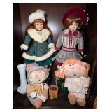 COLLECTIBLE DOLLS AND MORE IN CABINET AREA MARKED 1580