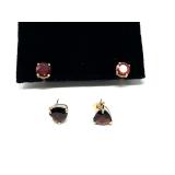 Lovely stud earrings with faceted Ruby/Garnet and fire opal colored stones, see pictures for details.