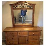 BR2…Wooden seven drawer dresser with mirror, has two shelf cabinet storage, this piece does have wear,