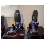 PAIR OF SHARK HAND VACUUMS WITH ACCESSORIES, ONE VACUUM MISSING CHARGING CORD