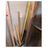 MEASURING STICKS, LEVEL, RULERS, AND MORE IN WALL AREA MARKED 1129