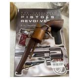 Pistol book and wooden pistol