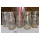 5 HALF PINTS MILKL BOTTLES / BUYING AS IS / SHIPS