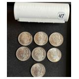 Lot# 47 (7) UNC Morgan Silver Dollars- 1880, 81, 83-85, 87 & 99