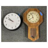 2 WALL CLOCKS - ONE IS BATTERY OPERATED AND THE