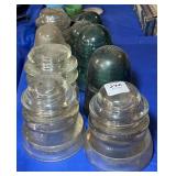 9 ASSORTED CLEAR AND GREEN GLASS INSULATORS