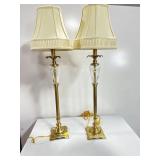 PAIR CRYSTAL AND BRASS CANDLESTICK BANQUET.