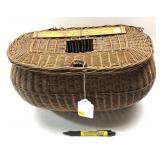 Early wicker fishing creel with ruler