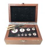 Set of scale weights in wooden case