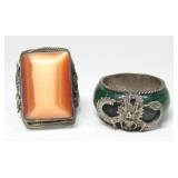 Lot, dragon decorated jade and orange stone rings,