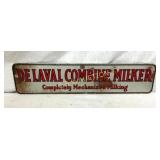 1957 DST DEVAL COMBINE MILKER SIGN 19 1/2X4 1/2