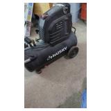 Husky 8 gallon Air Compressor.  Plugged in and