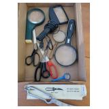 Box scissors and magnifying glasses