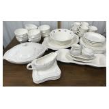 Set of dishes-plates, bowls, mugs, serving