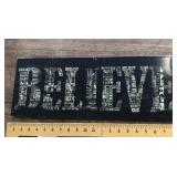 Metal "Believe" sign