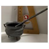 Cast iron cauldron and ladle