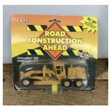 NEW Ertl die cast caterpillar motor grader