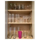 Cabinet full of clear glass and stemware