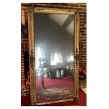 Heavy ornate antique mirror in gilt frame