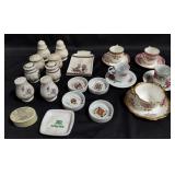 Group of tea cups, saucers, salt and pepper