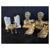 Group of brass and composite bookends and brass