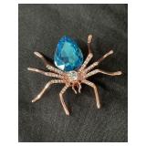 Copper tone spider brooch