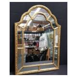 Gilt frame beveled wall mirror