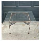 Vintage metal plant stand with glass top