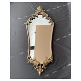 Wall mirror with metal frame