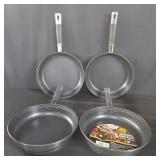 Four 9.4" stainless steel fry pans . box lot