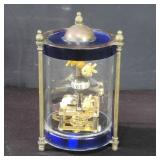 Vintage brass and glass mechanical clock