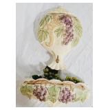 Ceramic grapevine adorned wall urn