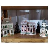 Shelf of Lefton Christmas Village pieces