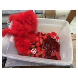 Red holiday decorations, ornaments, feather boas