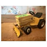 Toy garden tractor snow pusher