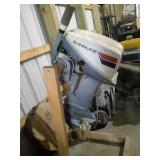 Evinrude boat motor with stand