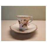 Antique vintage hand-painted teacup and saucer