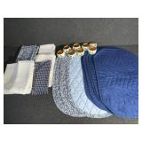 Blue sets of placemats, napkins