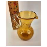 Small orange crackled glass pitcher