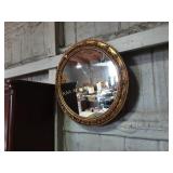 Round mirror in gilt frame - chips and wear.