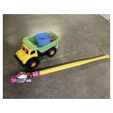 Plastic truck with toys, plastic wiffle ball and