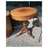 Wood pedestal accent table with brass claw feet -