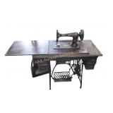 Singer sewing machine with treadle table some age