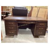 Mid-century wooden desk featuring a dark brown