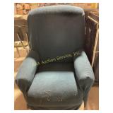 Comfortable armchair in a rich teal fabric. The