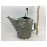 Galvanized watering can.